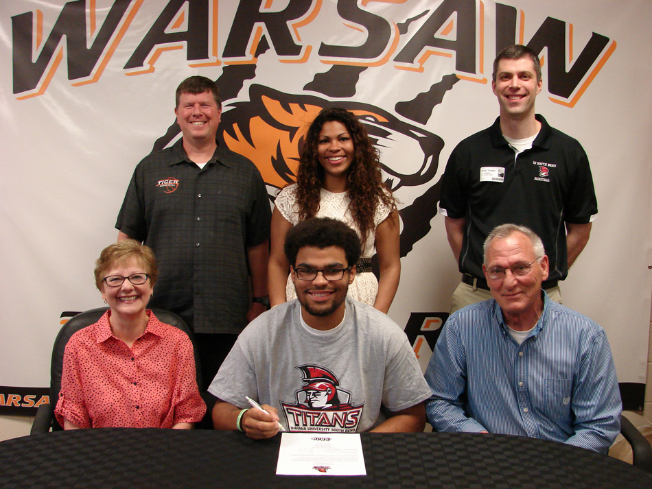 WCHS senior Rashaan Jackson has signed to play basketball at IUSB. Jackson is shown above with Cheryl and Mike Hanna. In back are WCHS boys basketball coach Doug Ogle, Ryesha Jackson and IUSB men's basketball coach Scott Cooper. (Photo provided)