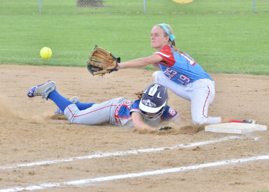 Whitko's Riley Insley hustles back to first as Aspen Bond tries to corral the pick-off attempt during Monday's sectional quarterfinal. (Photos by Nick Goralczyk)