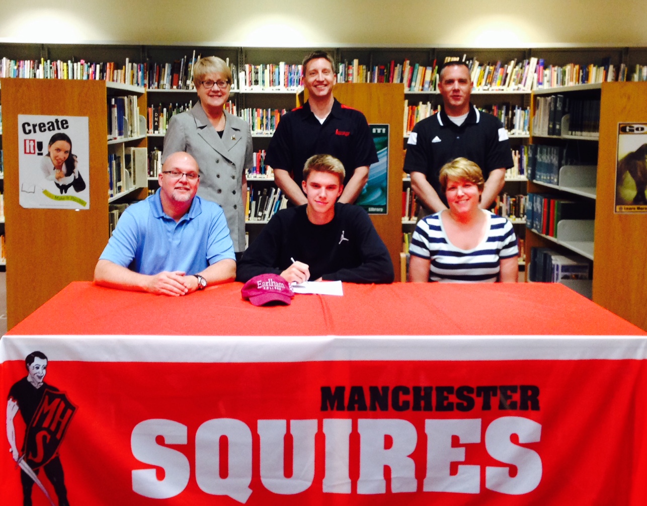 Manchester High School senior Chainey Zolman will play basketball at Earlham College. Zolman is flanked by his parents Chris and Jenny above. In back (from left) are Manchester principal Nancy Alspaugh, Manchester boys basketball coach Eric Thompson and Manchester athletic director Jeremy Markham (Photo provided)