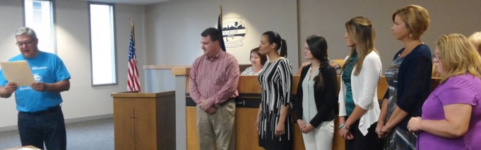 Warsaw Mayor Joe Thallemer reads a proclamation declaring May 4-8 as Chamber of Commerce Week. Shown on the right are Kosciusko Chamber of Commerce Staff. From left, are Mark Dobson executive director, Alyssa Lowe, Andrea Reed, Jennifer Pyle, Renea Salyer and Michael Goebel. 