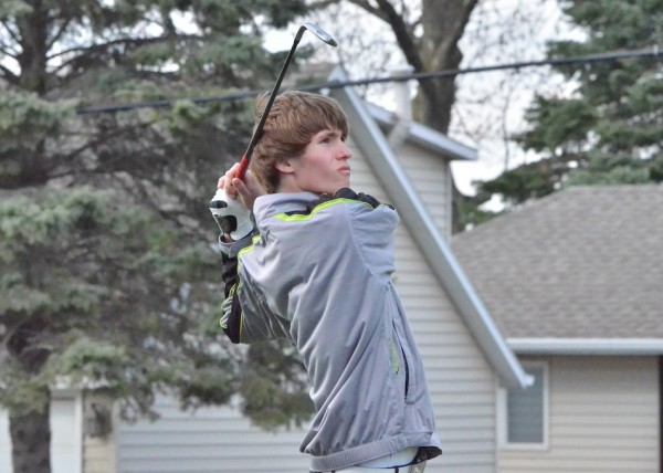 Cole Bechtold follows his drive on seven.