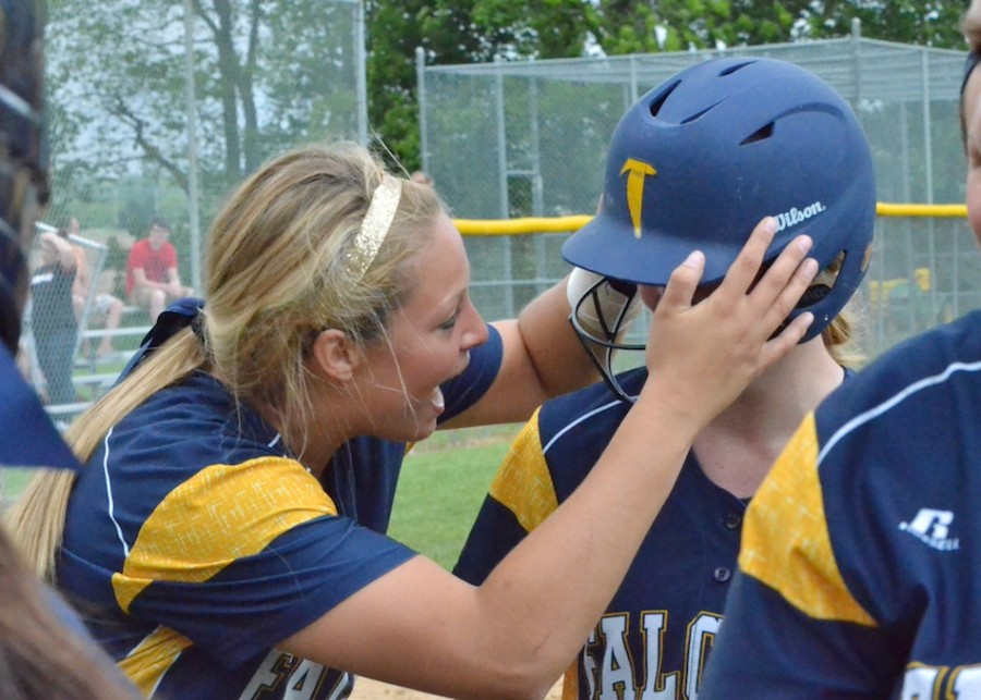 DJ Martz (left) shows some appreciation for Julia Brown (right) after Brown hit a lead-off home run in the third inning. 