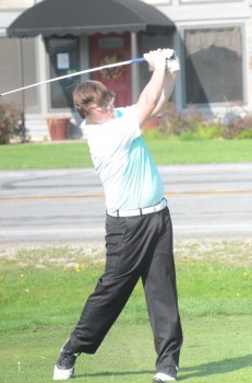 Tristen Atwood watches his tee shot.