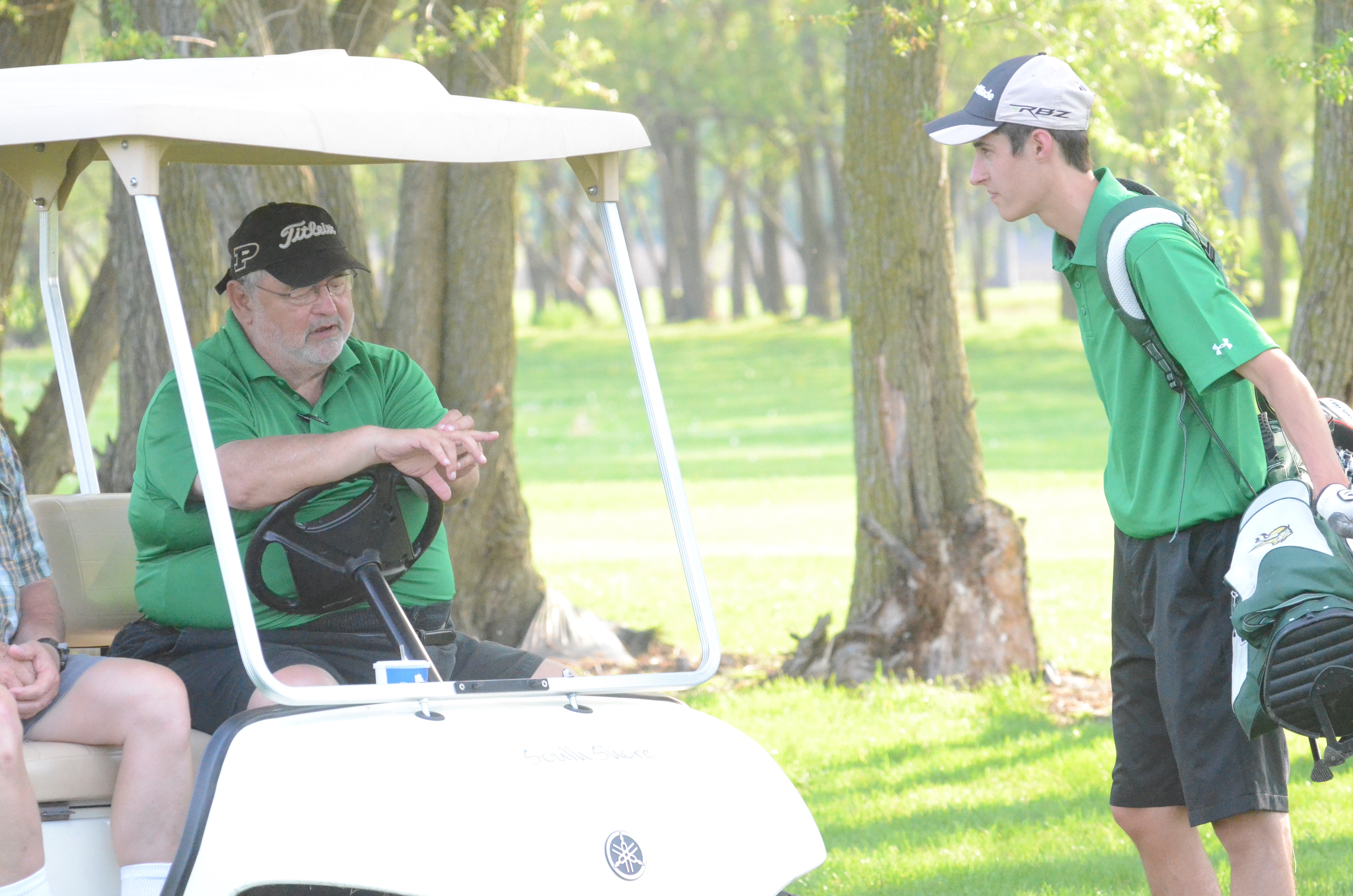 Tippecanoe Valley golf coach Roger Moriarty offers some advice to one of his players earlier this season. Moriarty will retired at season's end after three decades of coaching.