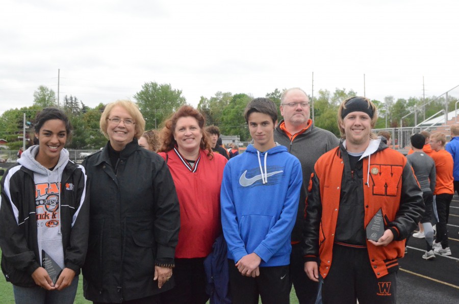 WCHS seniors Tennie Worrell (at far left) and Andrew Scheidt (at far right) are shown with members of the Morrey Hester family. Worrell and Scheidt received the Morrey Hester Spirit Award prior to the NLC Track Meet at WCHS Tuesday night.