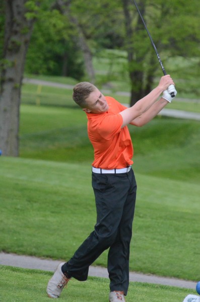 Warsaw's Michael Jensen hits a tee shot Thursday. Jensen shot 40 as the Tigers topped Concord and Goshen in NLC action in Elkhart.