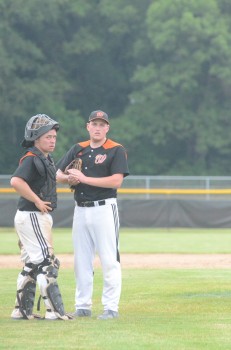 Warsaw reliever Blake Foreman talks it over with catcher Ryan Marshall.