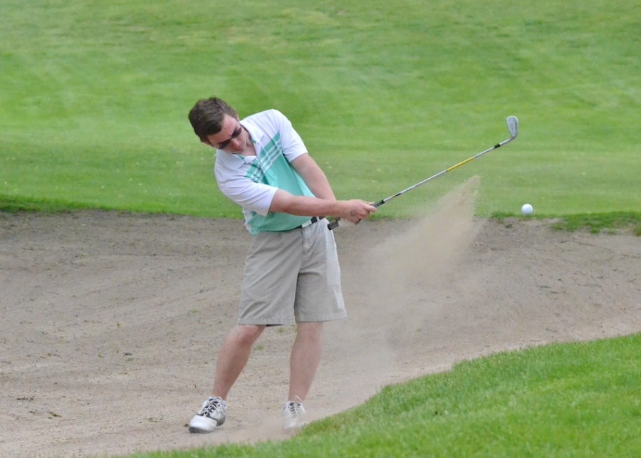 Dustin Brown hits out of a bunker on No. 5 for Wawasee's JV.