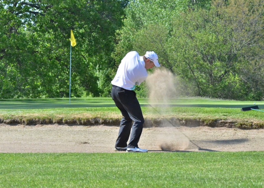 Jeffrey Moore hits onto the green on No. 1 at South Shore during Thursday's win over Warsaw. Moore was the medalist with a 37. (Photos by Nick Goralczyk)