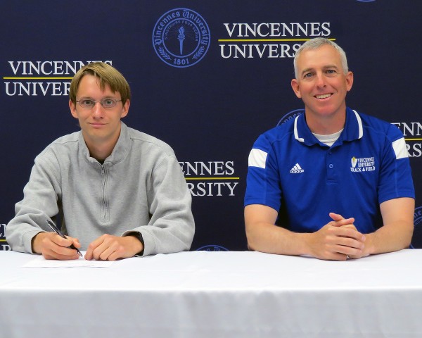 Robert Murphy, a former track and cross country standout at WCHS, is moving on from Vincennes University to IUPUI. Murphy is shown above with Vincennes coach Chris Gafner (Photo provided)