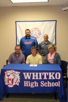 Whitko senior Tanner Hughes signes to play football at Defiance College. Hughes is shown with his parents Todd and Robin. In back are Whitko football coach Josh Mohr and Whitko athletic director Casey Stouffer (Photo provided)