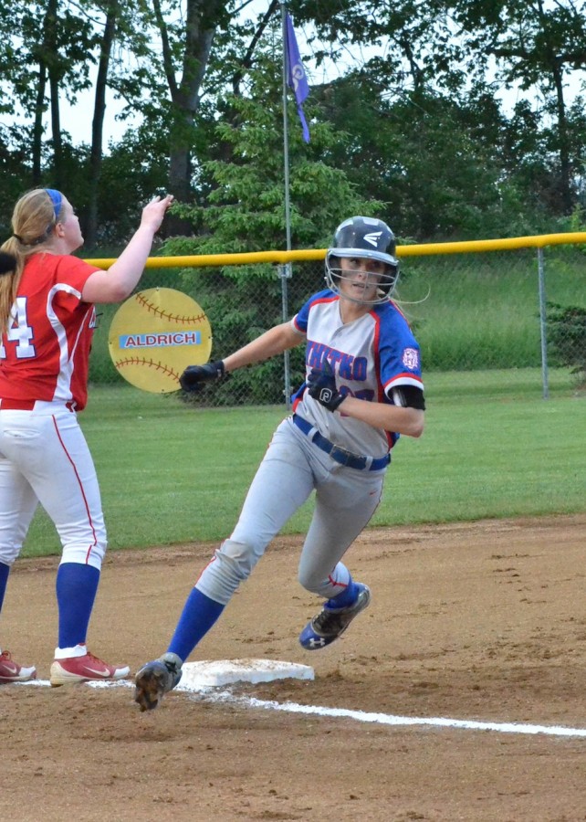 Whitney Marsh rounds third on her way to scoring a run for Whitko.