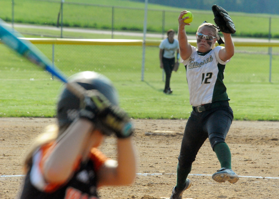 Wawasee pitcher Meghan Fretz was dealing aces all night against Warsaw, allowing just three hits and one run in Wawasee's 11-1 victory. (Photos by Mike Deak)