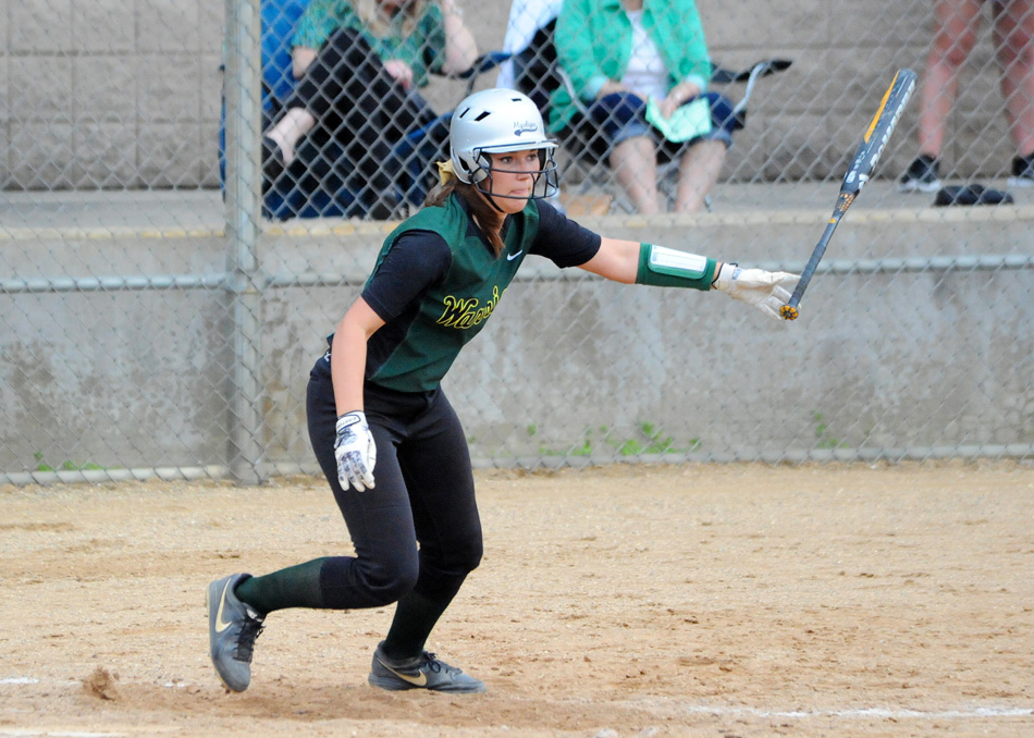 Paige Hlutke uncorks a two-run single in the fifth inning of Wawasee's 5-0 at Concord Monday afternoon. (Photos by Mike Deak)