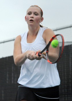 Warsaw No. 3 singles player Ella Knight makes solid contact against Columbia City.
