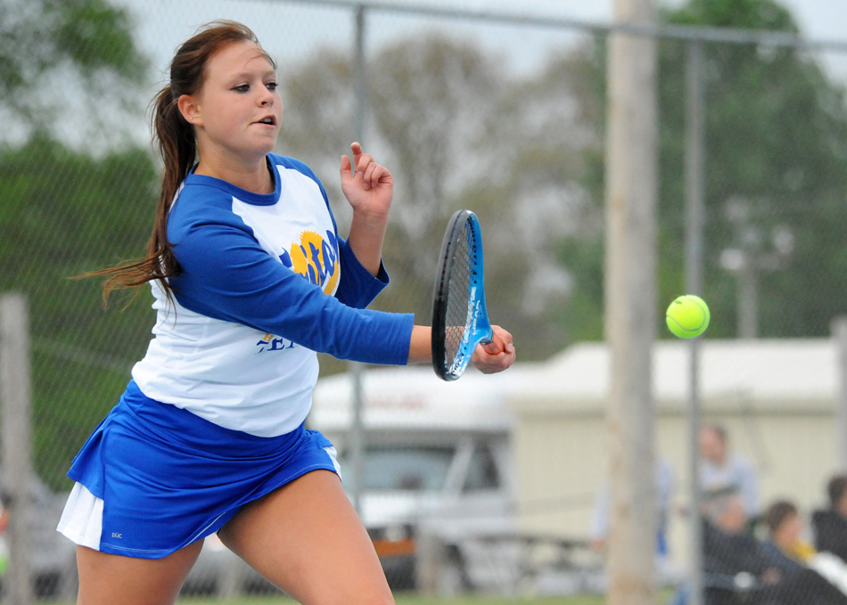 Triton No. 2 singles player Shayla May volleys against Knox's Brooke Eby in the opening round of the Northern State Conference girls tennis tournament Thursday at Bremen.