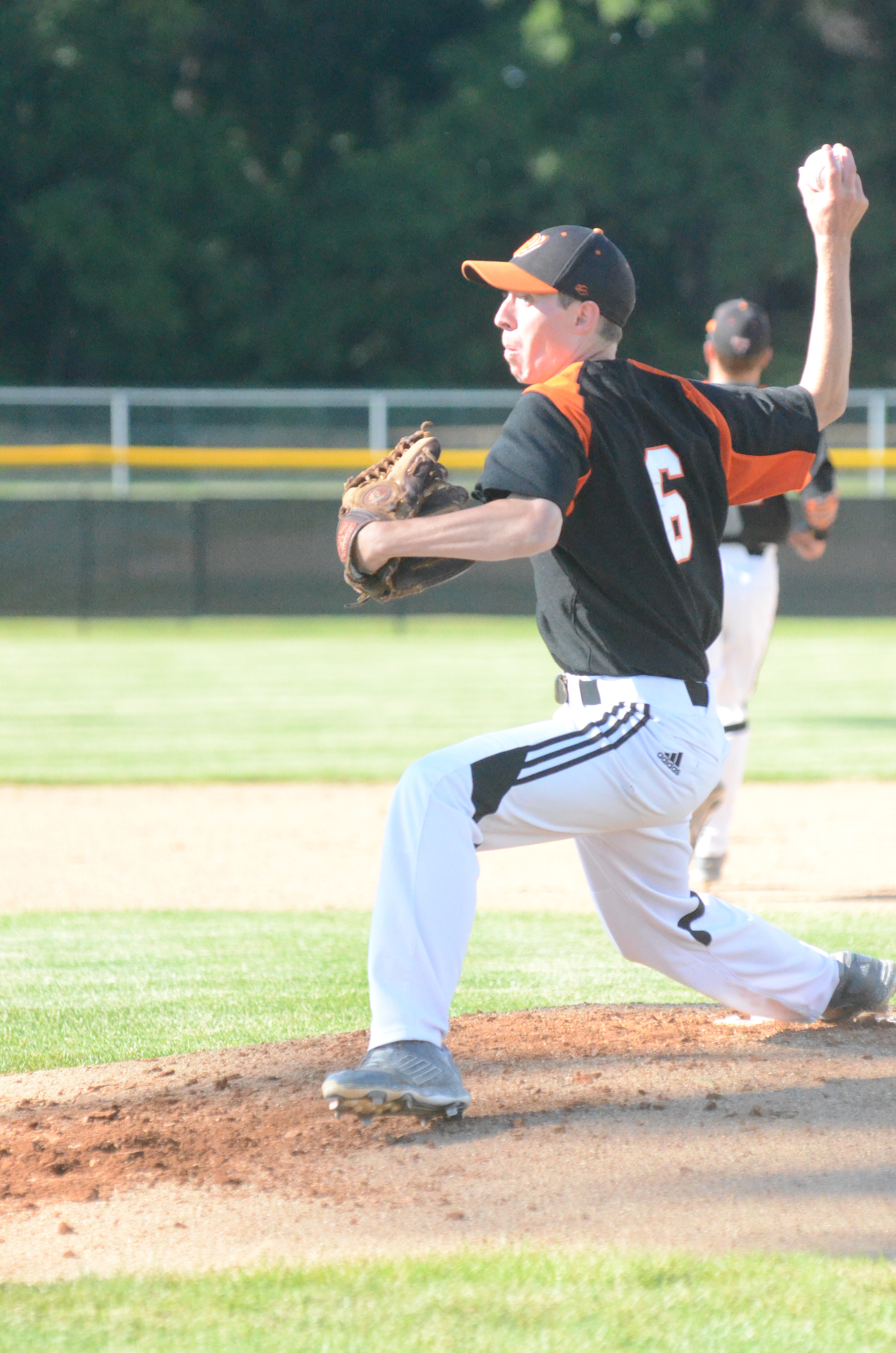 Warsaw's Kevin Hawley prepares to fire a pitch Monday night in the sectional title game at Elkhart Memorial.