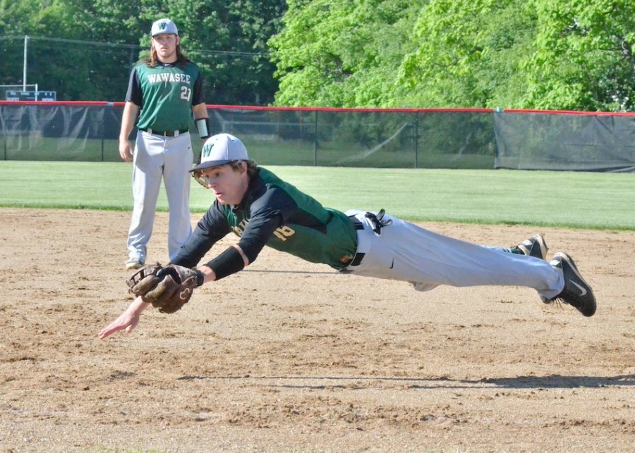 Gage Reinhard makes an incredible play at first base trying to beat a runner in the sixth inning of Wawasee's loss to NorthWood. (Photos by Nick Goralczyk)