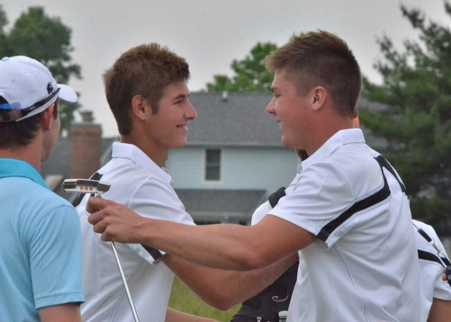 Jonny Hollar (at right) is congratulated by teammate Ryan Cultice after winning a playoff at the Warsaw Regional on Thursday to advance to State. Hollar will compete in the State Finals Tuesday and Wednesday in Carmel (File photo by Nick Goralczyk)