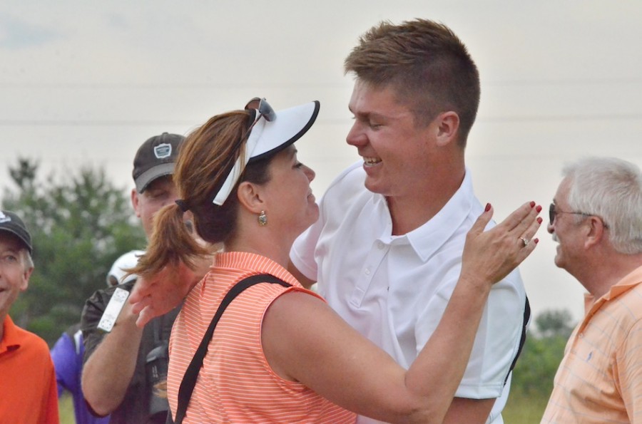 Jonny Hollar is congratulated by his mother after clinching a spot for next week's IHSAA State Finals.