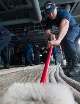 Seaman Travis Lightle, from North Manchester, scrubs mooring line on USS John C. Stennis’ fantail. Stennis (CVN 74) is currently undergoing an operational training period in preparation for future deployments. 