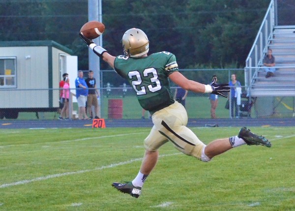 Clayton Cook reaches for a grab in last year's home opener for Wawasee. (File photo by Nick Goralczyk)