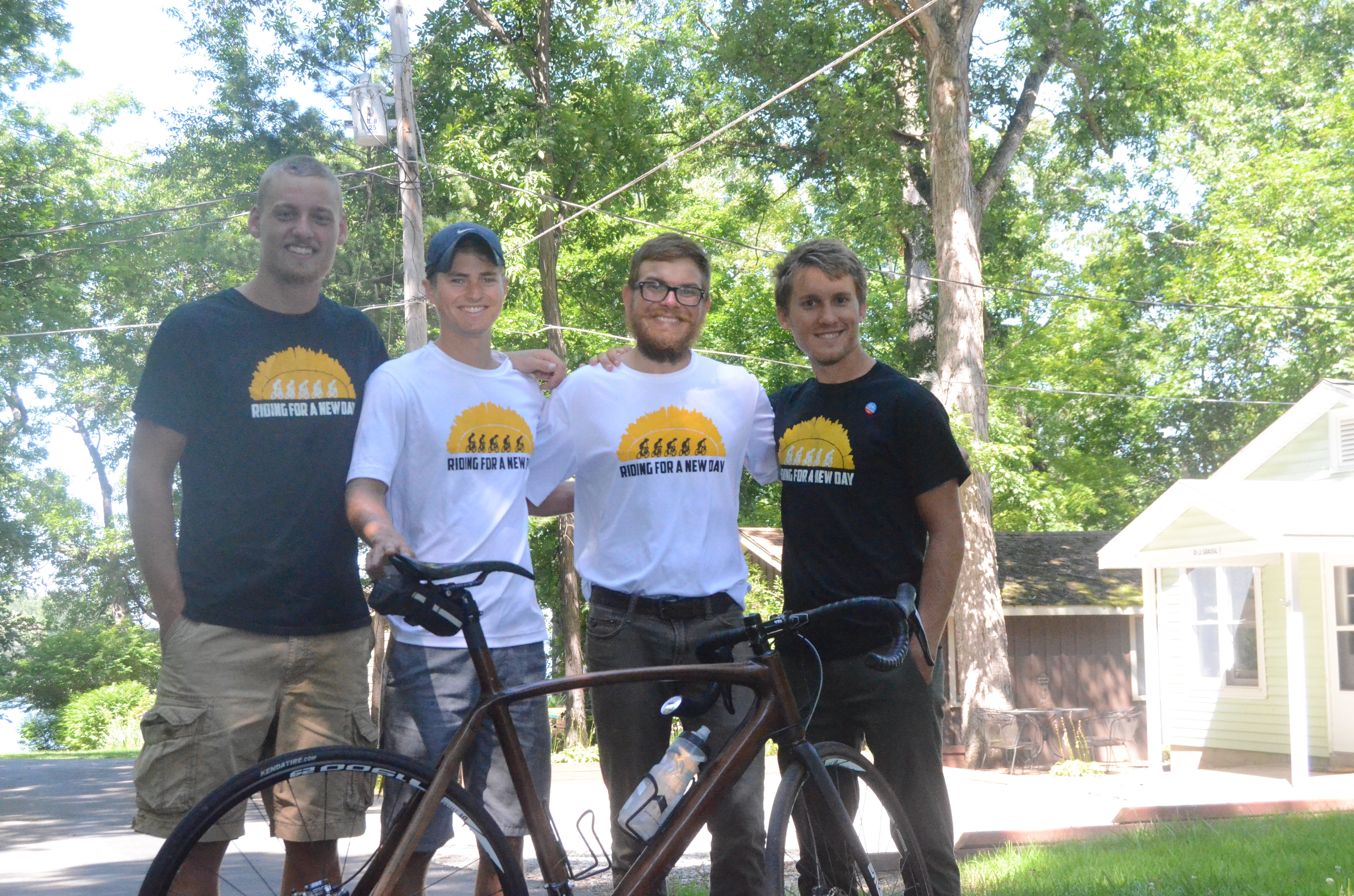 The four young men shown above are biking across country. The Cedarville University graduates, who expect to end the trip in New York state in August, are (left to right) James Blackwell, Ben Tuttle, Greg Johnson and Ryan Gustafson.
