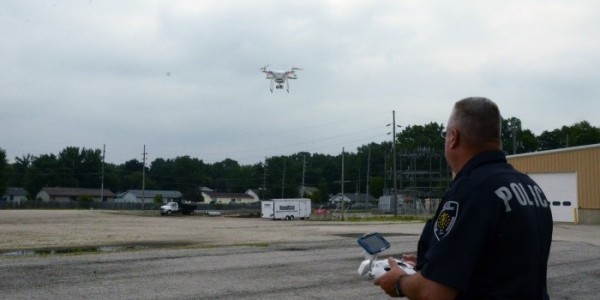 Shuter demonstrates the capabilities of the quadcopter outside of Warsaw Police Department.  