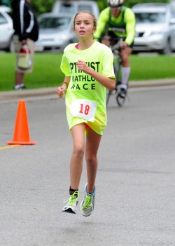 Erin Rivich competes in the 2015 Warsaw Optimist Triathlon in Winona Lake. The Warsaw Parks and Recreation Department as well as the Warsaw Breakfast Optimist Club are hosting a Kid's Triathlon Clinic. (File photo by Mike Deak)