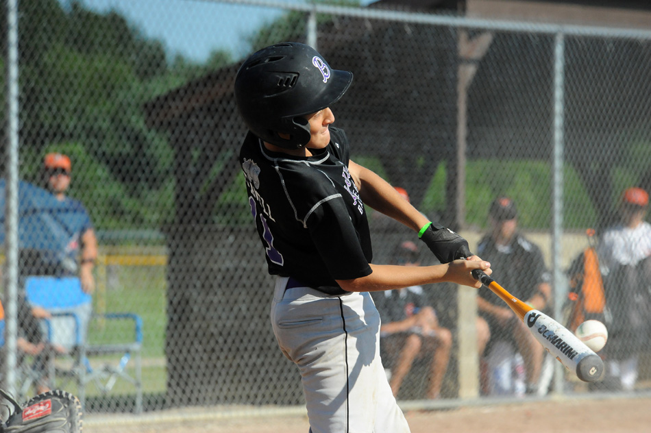 New Haven Bulldogs Black slugger Langston Leavell rips a base hit during the team's 6-4 win over team in the opening round of the BPA World Series 10U tournament. (Photos by Mike Deak)