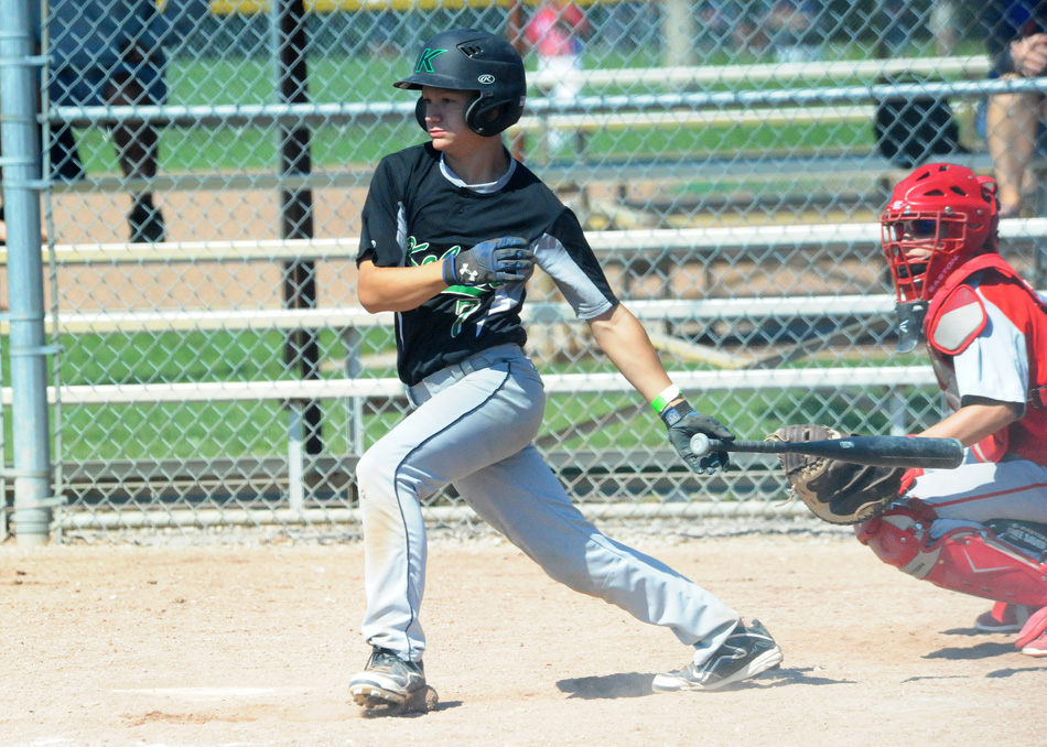 Kalamazoo Kobras' Tyler Rigling makes contact during the BPA Tournament. (Photos by Mike Deak)