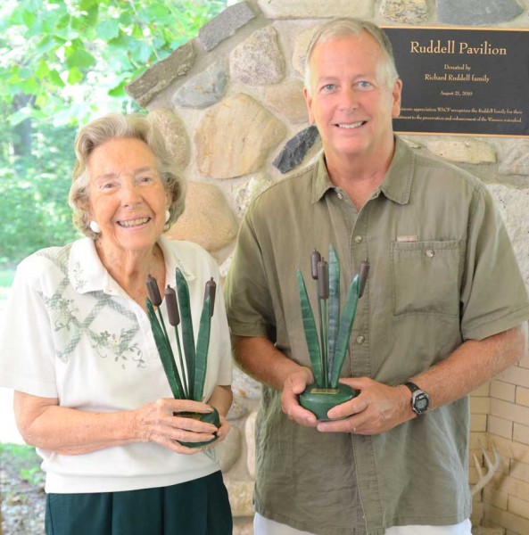 Laurie Hardie, left, and Bob Fanning, representing the Levinson-LaBrosse family, were recipients of the 2015 Cattail Award.