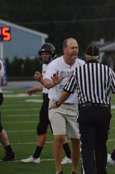 Warsaw coach Phil Jensen lobbies for a call Friday night.