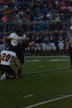 Andrew Mevis drills a field goal for the Tigers. The junior had a superb game handling the kicking duties.