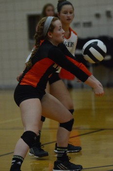 Blake McGarvey serves receive for the Tigers.