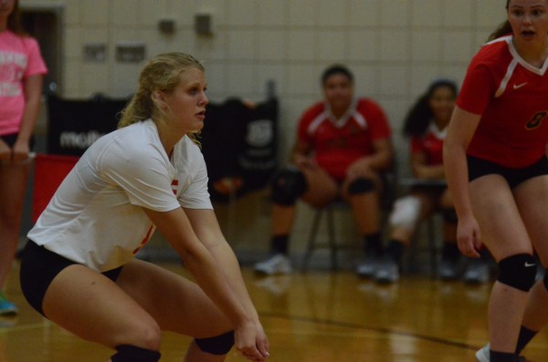 Elkhart Memorial libero Lindsey Stahl prepares to make a play Saturday.