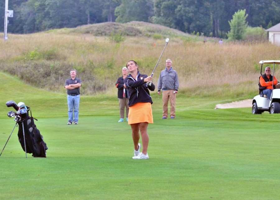 Page Desenberg checks out her shot on 18 with her personal gallery in tow during Wednesday's match against Wawasee and Concord. (Photos by Nick Goralczyk)