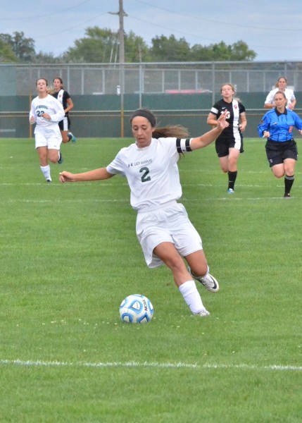 Sarah Lancaster works her way up field for the Lady Warriors. 