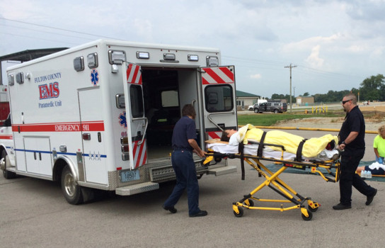 Fulton EMS officers transporting fake victims of the chemical spill.