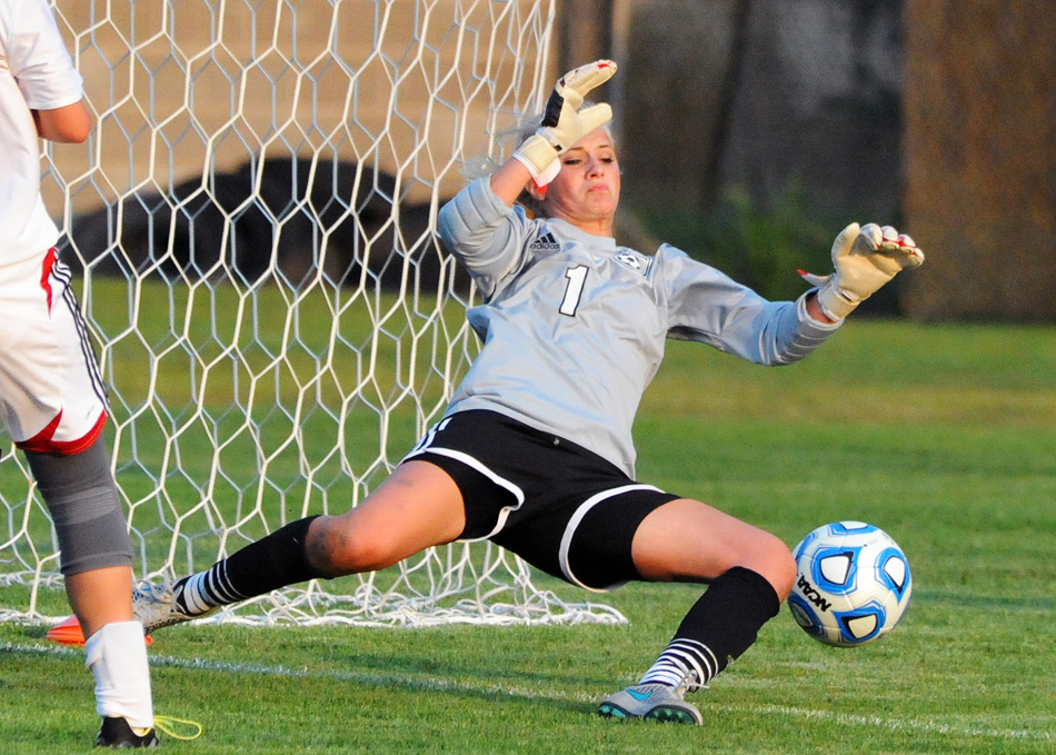 NorthWood keeper Madi Eberly flies in to make a save on a Warsaw shot in the first half.