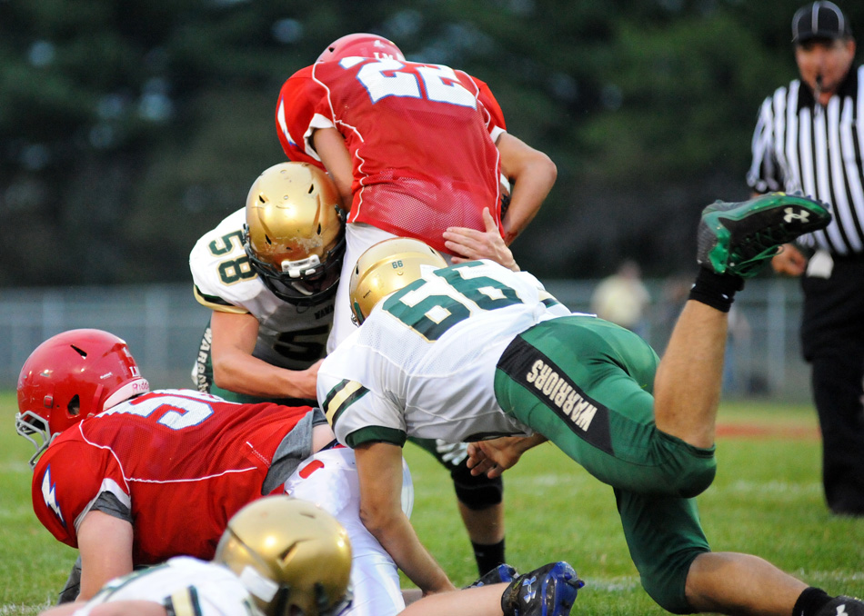 Stephen Possell (58), Andy Holdeman (66) and the Wawasee defense clamped down on West Noble in a 37-12 win Friday night in Ligonier. (Photos by Mike Deak)