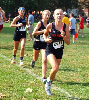 Warsaw's Mia Beckham sprints with Penn's Lauren Frank during the Girls Elite race at the Culver Academy Invitational. (Photo by Tim Creason)