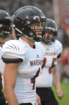 Riley Rhoades looks on Friday night. The Warsaw receiver had 17 catches for 155 yards.