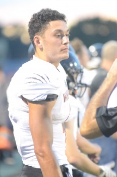 Riley Rhoades looks on from the sideline. The senior star had 214 yards receiving and two touchdowns.