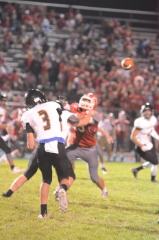 Warsaw quarterback Michale Jensen lets one fly Friday night. Jensen passed for 338 yards and three touchdowns in a 35-7 win at Goshen.
