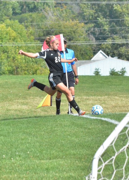 Dayle Harvery launches a corner kick for the Tigers during Saturday's 8-0 win over Wawasee. (Photos by Nick Goralczyk)