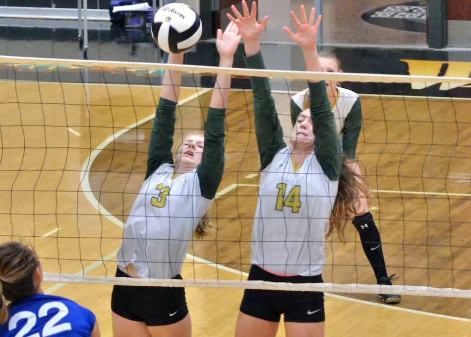 Wawasee's Peyton Rookstool and Hannah-Marie Lamle go up for a block during the match against Whitko at the Wawasee Volleyball Invite Saturday morning. (Photos by Nick Goralczyk)