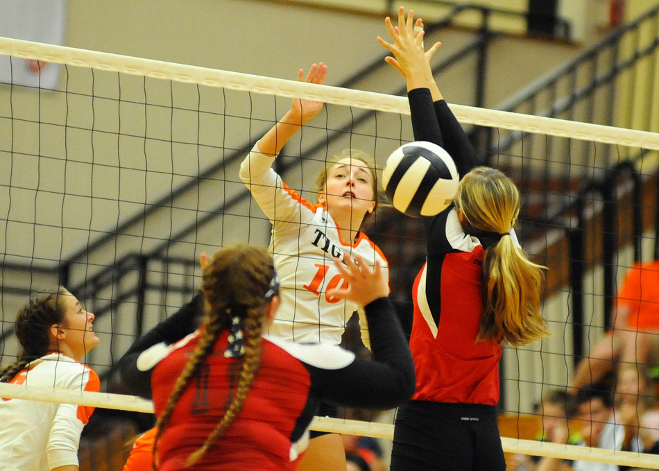 Lexie Day of Warsaw crushes a kill shot through Plymouth's defense.