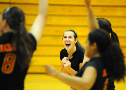 Memorial setter Krystal Grubb celebrates a point with her team.