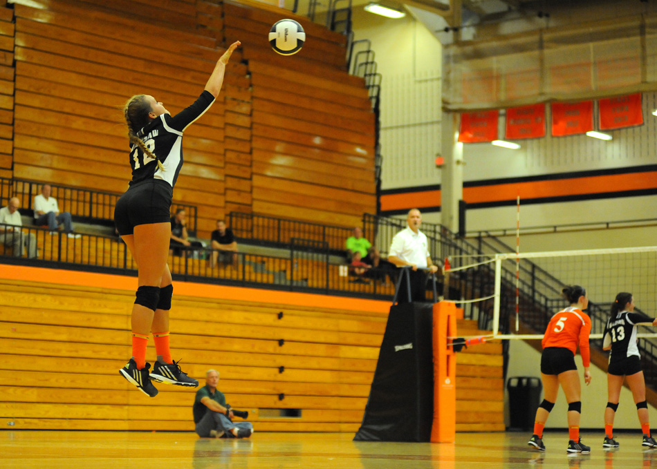 Haley Peterson of Warsaw serves it up to Elkhart Memorial Tuesday.